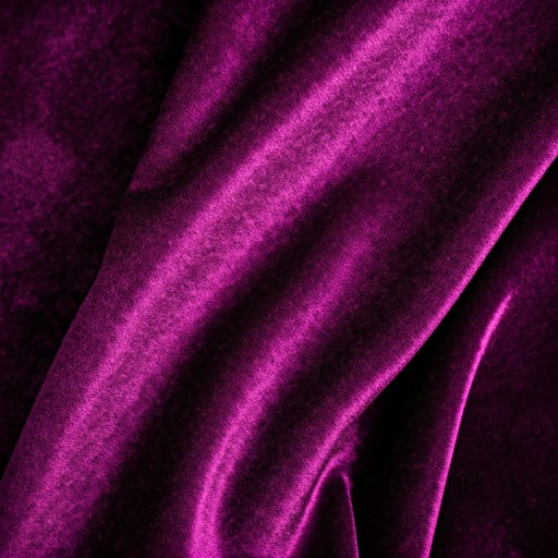 Close up of luxurious deep purple velvet fabric with soft highlights